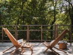 Chairs on treehouse deck